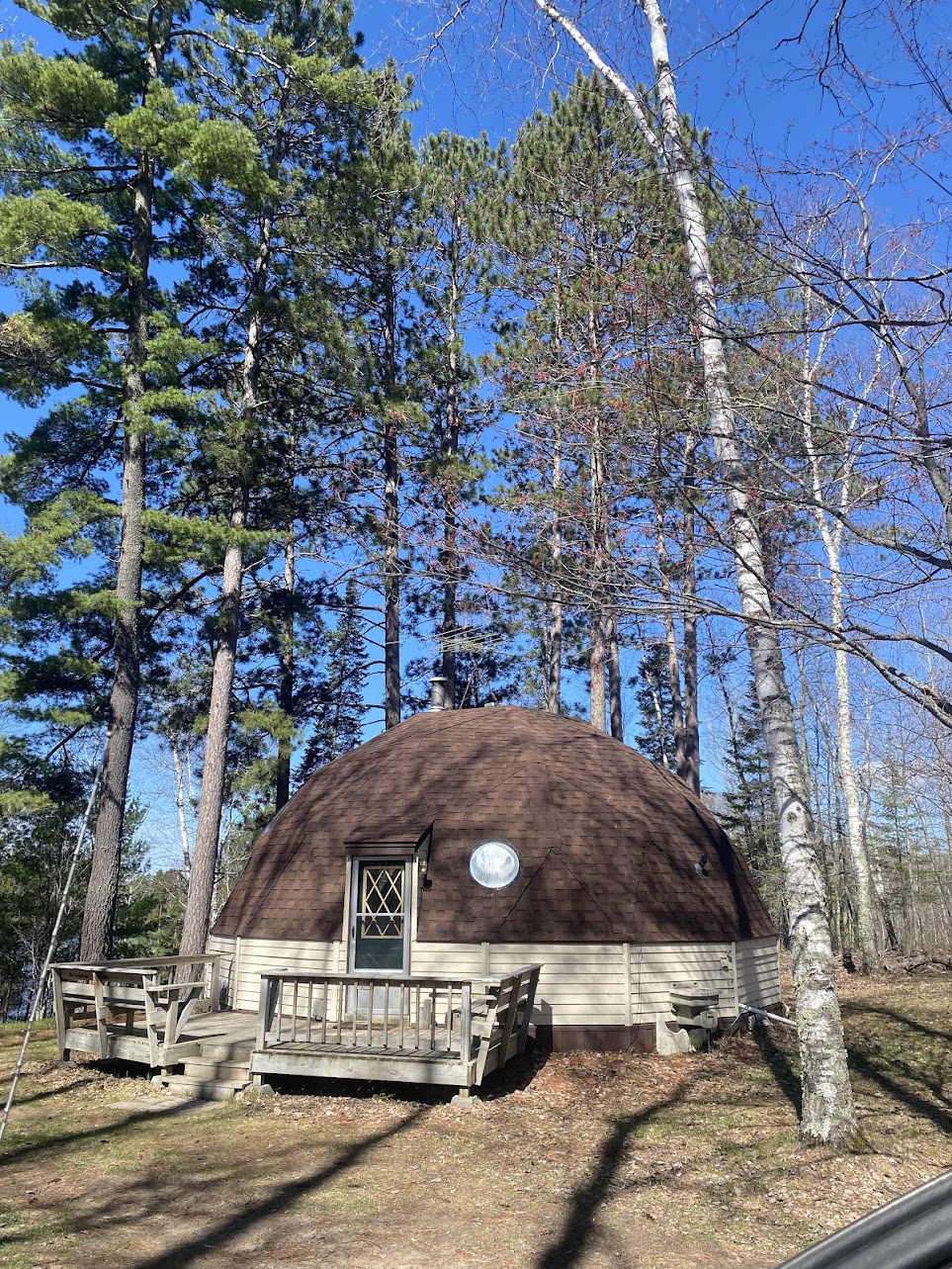 Image of the Dome Home surrounded by trees