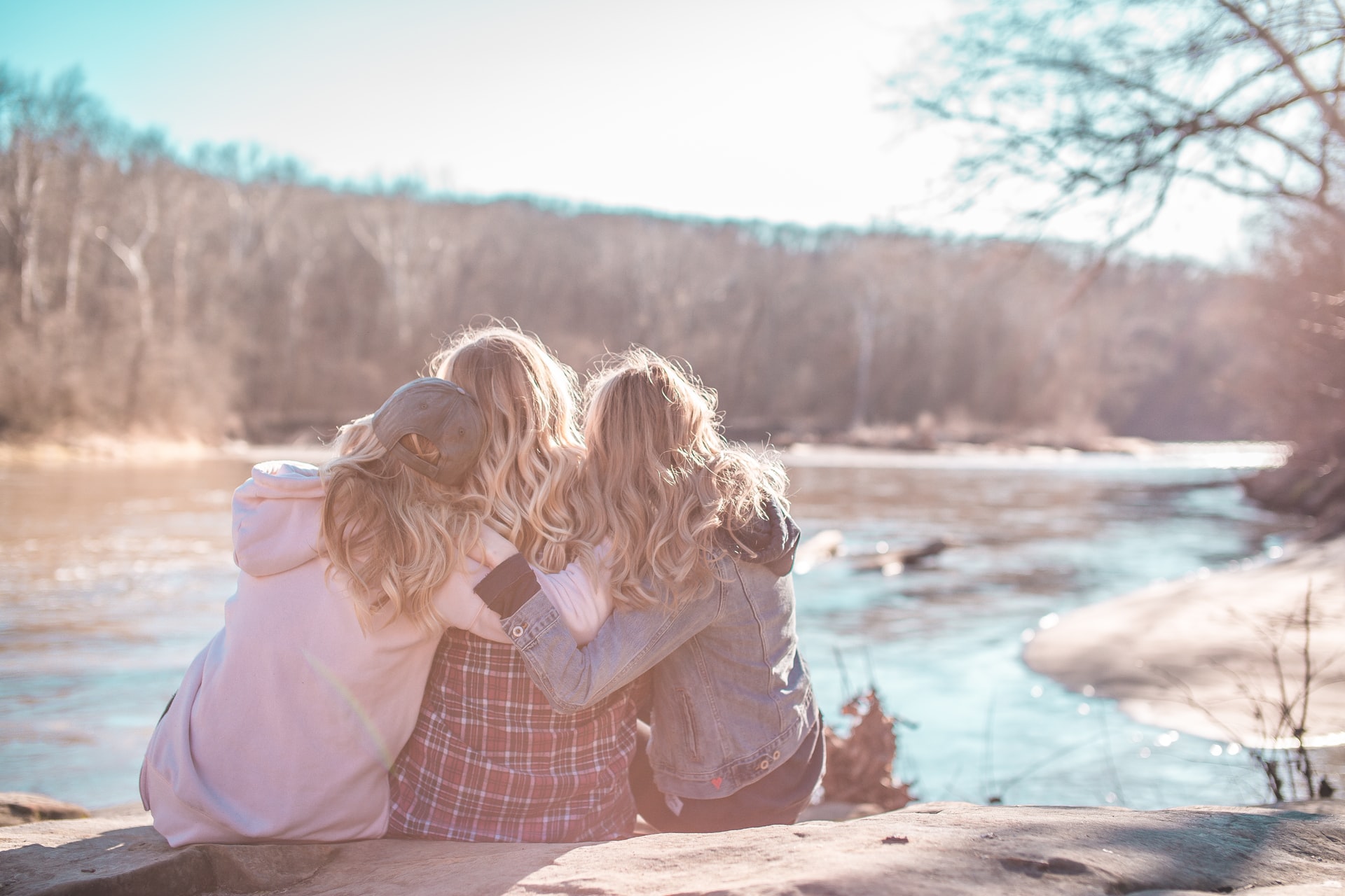 Image of women hugging by the lake