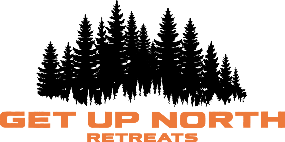 Logo for GET UP NORTH RETREATS, featuring black illustration of pine trees.